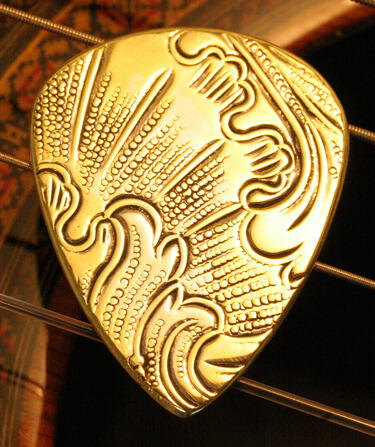 antique brass guitar pick