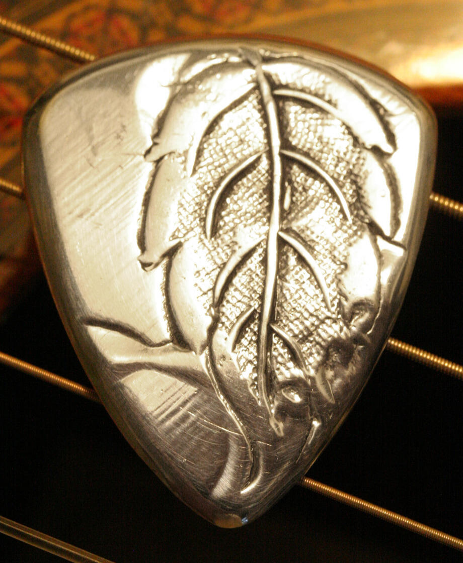antique aluminum guitar pick