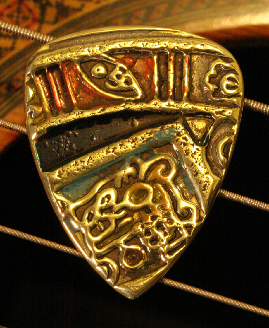 antique brass guitar pick